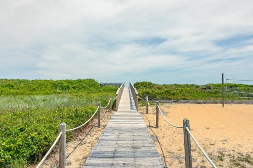 a wooden boardwalk leading to a sandy beach at 4204 - Outer Thanks in Duck