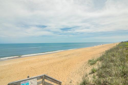 a view of a beach with people walking on it at 4204 - Outer Thanks in Duck