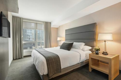 a hotel room with a large bed and a window at Scarlett Near Cane River Falls in Bull Bay