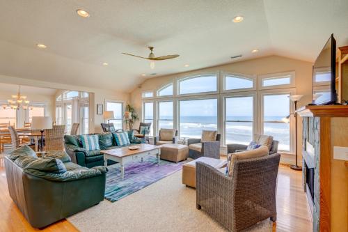 a living room filled with furniture and a large window at 2869 - Seascape in Duck