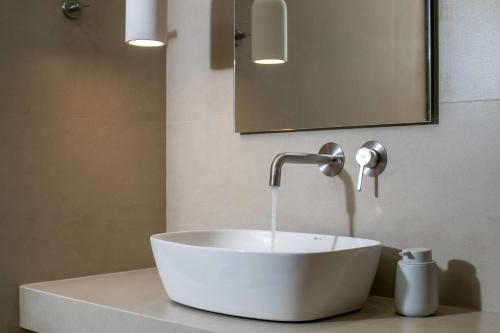 a sink with a faucet on a counter in a bathroom at Charaki Rest Point in Haraki