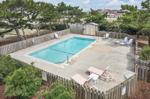 a swimming pool with a fence around it at 7660 - Robyn's Nest in Avon