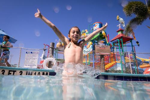 a woman in the water at a water park at Coco Key Hotel & Water Park Resort in Orlando
