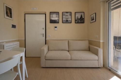 a living room with a couch and a table at Sinarca Elysium Apartment in Termoli