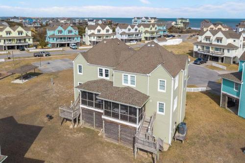 an aerial view of a house in a residential neighborhood at 7766 - Striper in Buxton