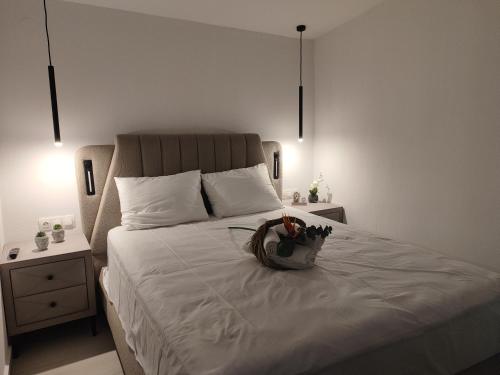 a bedroom with a bed with a basket on it at Ktima Anna in Astris