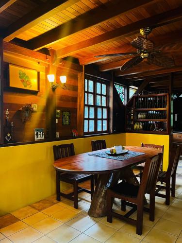 a dining room with a wooden table and chairs at Beyond Paradise Vacation Rental in Cristo Rey