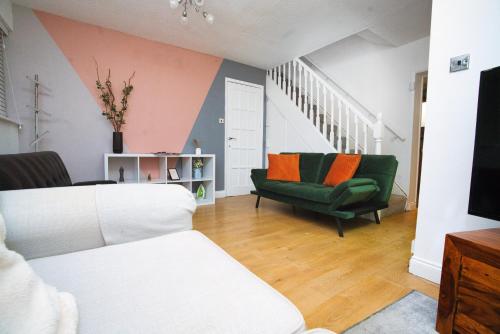 a living room with two chairs and a couch at Home close to city center home in Milton Keynes