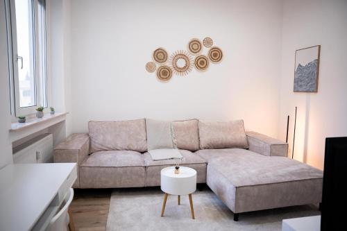 a living room with a couch and a table at Design Apartment - Solingen-Mitte - Balkon - BRIGHT Collection in Solingen