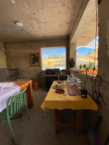 a small room with a table and a window at Casona san isidro in Vicuña