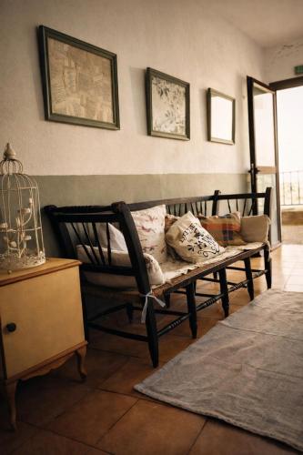 a living room with a couch and a chair at Albergue la Fontanina ALCC00043 in Mata de Alcántara