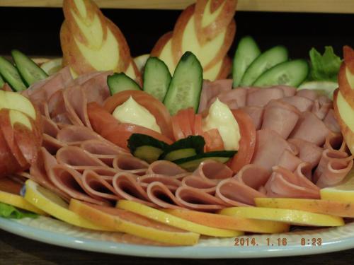 a plate of different types of meat and vegetables at Hotel Crown Hills Katsuta Omotechoten in Hitachinaka
