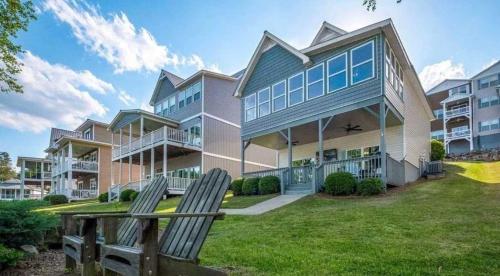 a house with two lawn chairs in front of it at 43 Making Memories in Leesburg