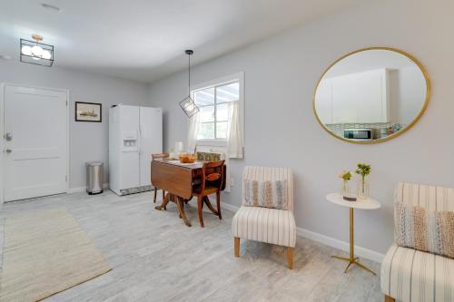 a living room with a desk and a mirror at Golf, Swim and Grill Out Phoenix Gem 10 Mi to Dtwn in Phoenix