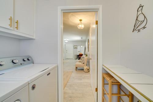 a kitchen with white cabinets and a kitchen island at Golf, Swim and Grill Out Phoenix Gem 10 Mi to Dtwn in Phoenix