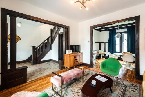 a living room with a couch and a table at Luxe Mid-Century Styled Townhouse #3631 in Detroit