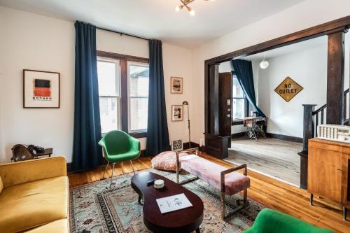 a living room with a couch and a table at Luxe Mid-Century Styled Townhouse #3631 in Detroit