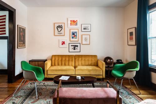 a living room with a couch and chairs at Luxe Mid-Century Styled Townhouse #3631 in Detroit