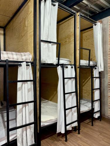 a group of bunk beds in a room at Hostal KEMMM in Mexico City