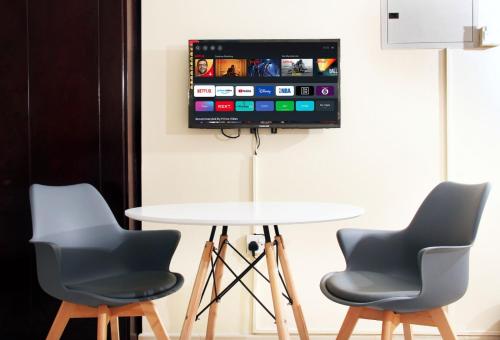 Televisor o centre d'entreteniment de BARAKAH HOTEl