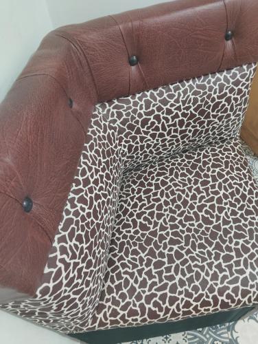 a brown couch with a pillow on top of it at Marrakesh Classic House 20 in Marrakesh