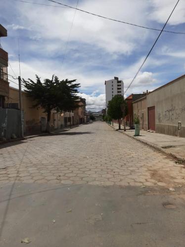 a cobblestone street in a town with a building at Valeria Victoria in Los Limos