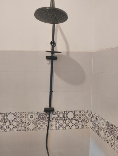 a shower with a light on top of a shower curtain at Marrakesh Classic House 20 in Marrakesh