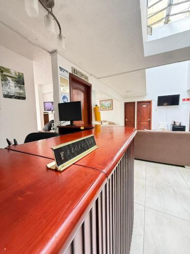 a bar with a keyboard on top of it at Hotel Dinastia in Ipiales