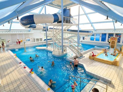 a pool on a cruise ship with people in it at 8 person holiday home in Børkop-By Traum in Børkop