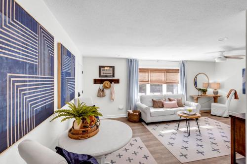 a living room with a white couch and a table at The Porter Chamber in Ocean Springs