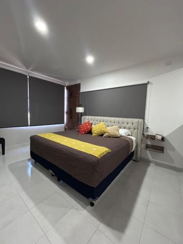 a bedroom with a large bed in a room at Casa Cerritos in Comitán