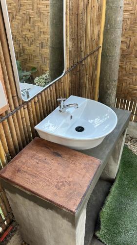 a bathroom sink with a mirror on a counter at VISTA Cadlao in El Nido Airport