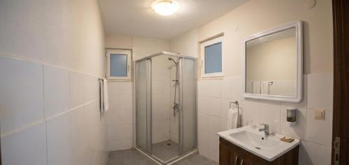 a bathroom with a shower and a sink at Rasim otl in Göksun
