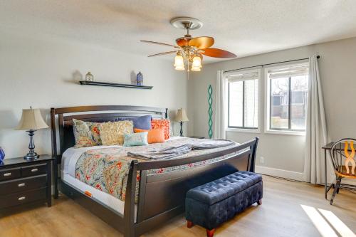 a bedroom with a bed and a ceiling fan at Relax Poolside! Lake-View Retreat in Osage Beach in Osage Beach