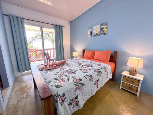 a bedroom with a large bed and a window at Guanico Beach Resort in Tonosí