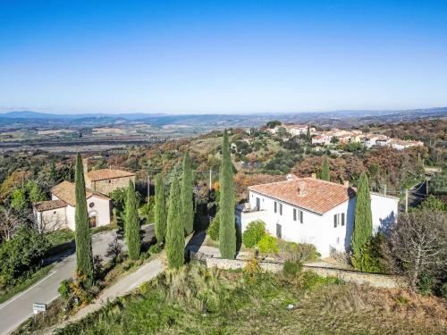 an aerial view of a white house with cypress trees at Holiday Home Nobile by Interhome in Polveraia