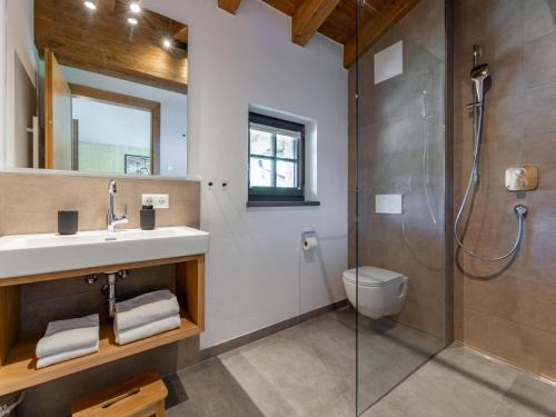 a bathroom with a sink and a shower at Wagrainer TauernLodge 42C in Wagrain