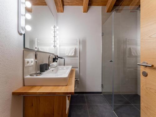 a bathroom with a sink and a shower at Wagrainer TauernLodge 42A in Wagrain