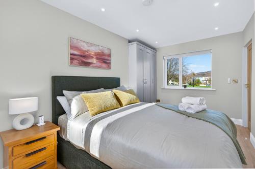 a bedroom with a large bed and a window at Martin Savage in Sligo