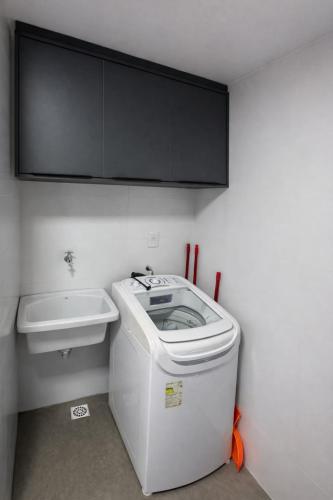 a small bathroom with a toilet and a sink at Flat PREMIUM em Manaíra - Sun Beach in João Pessoa