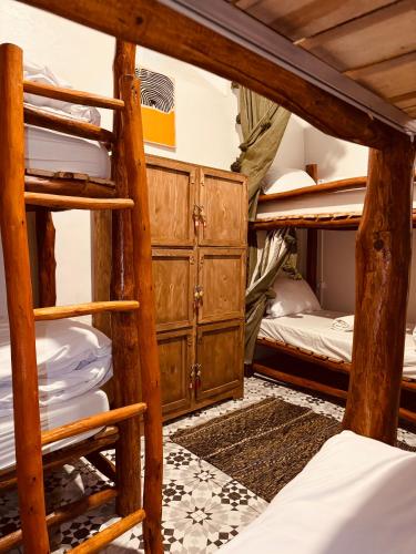 a bunk bed room with two bunk beds at essaouira van hostel in Essaouira