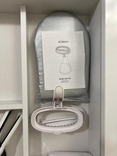 a drawer with a picture of a no vacuum in it at 수지의 하우스 in Cheonan