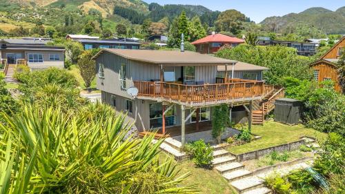 an aerial view of a house with a deck at Kotare Heights in Pohara