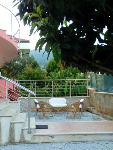 a patio with two chairs and a table at 60Quattro bedrooms in Lamezia Terme