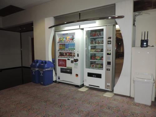 two vending machines are sitting in a room at Hotel Grand Terrace Chitose in Chitose