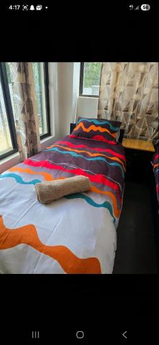 Postel nebo postele na pokoji v ubytování Fourscapes B&B