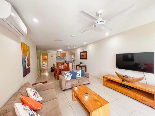 a living room with a large flat screen tv at BHA 4 Beachfront Bliss 2 bed in Mission Beach