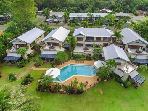 an aerial view of a resort with a swimming pool at Wongalinga Absolute Beachfront Unit 9 2 Bedroom in Mission Beach