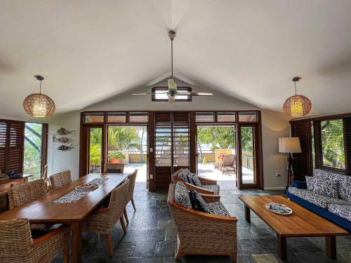 a dining room with a table and chairs at Wongalinga Absolute Beachfront Unit 9 2 Bedroom in Mission Beach