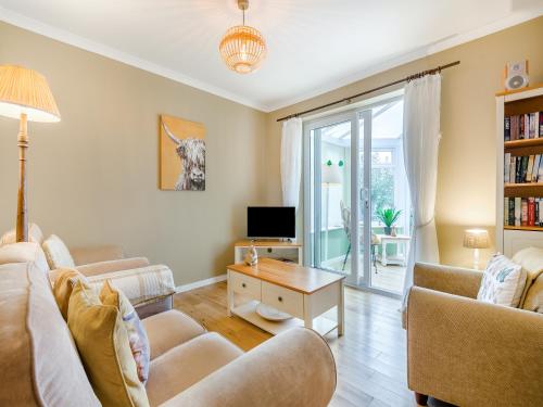 a living room with two couches and a tv at Anchors Away - 29566 in Blue Anchor